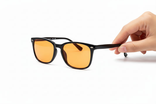 Red-tinted anti–blue light glasses designed to improve sleep for men and women.